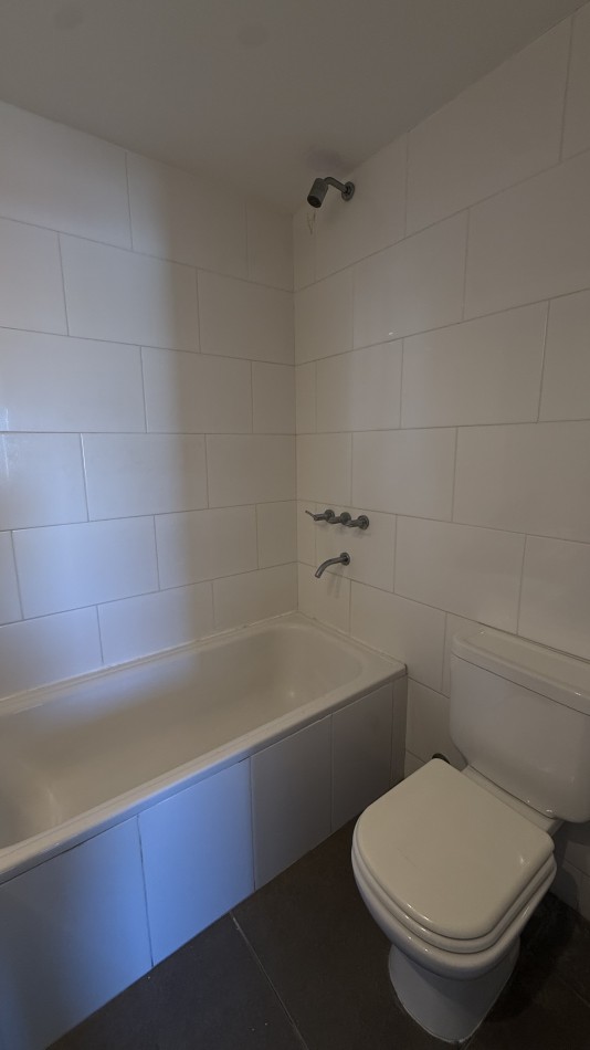 Departamento tres ambientes con cochera 